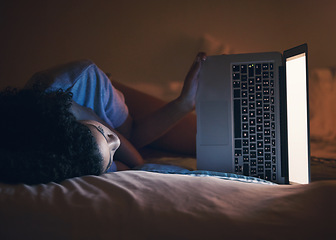 Image showing Laptop, bed and woman on internet at night for website, online social media and relax in home. Bedroom, computer and person streaming movie, film and video on pc technology with insomnia in house.