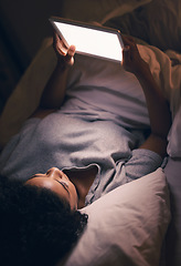 Image showing Woman, tablet and bed in night with reading, blank screen and search for video, chat or social media app. Girl, digital touchscreen and mockup space with empty ux, scroll or watch movie in dark home