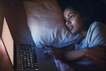 Image showing Laptop, bed and woman on internet at night for website, online social media and relax in home. Bedroom, computer and person streaming movie, film and video on pc technology with insomnia in house.