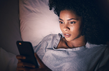 Image showing Sad, night and phone with woman in bedroom for social media app, insomnia and networking. Communication, contact and internet with female person in bed at home for mobile, online and technology