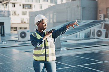 Image showing Black woman point, solar panel and speaker phone call for photovoltaic plate, renewable energy grid or project voice note. Rooftop view, cellphone and female engineer talk about construction building