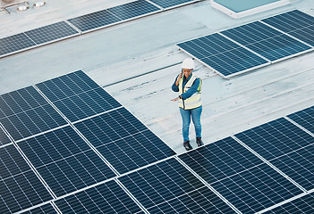 Image showing Rooftop phone call, solar panel and woman conversation about photovoltaic plate, renewable energy or project design. Roof top view, cellphone and female engineer inspection of power grid construction
