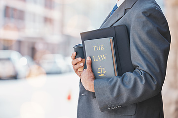 Image showing Law, book and businessman or lawyer with legal books, constitution or research on regulation or policy knowledge. Attorney, judge or information on a case in court, government or expert on laws