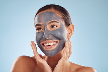 Image showing Woman thinking, mask and facial charcoal for skincare, natural beauty and cosmetics benefits on studio, blue background. Ideas of happy person or model with face collagen, skin care and dermatology