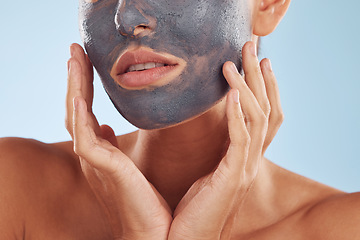 Image showing Face mask, charcoal and beauty of woman with facial cosmetic treatment isolated in a blue studio background. Skin, skincare and young female person with clean, hydration and dermatology cream