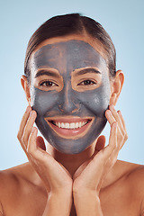 Image showing Woman, face mask and charcoal for beauty, skincare and natural cosmetics cleaning product on studio, blue background. Portrait of person or model in facial collagen and mud skin care for dermatology