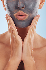 Image showing Face mask, charcoal and beauty of woman with skincare facial treatment isolated in a blue studio background. Skin, cosmetic and young female person with clean, hydration and dermatology cream