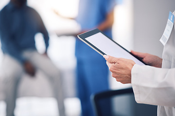 Image showing Tablet, hands and doctor with mockup in hospital for healthcare services, surgery data and working in busy clinic. Closeup, medical professional and digital technology screen for planning research