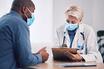 Image showing Woman, doctor and writing on clipboard with patient in consultation, checkup or life insurance at hospital. Female person, medical or healthcare expert with face mask consulting customer at clinic