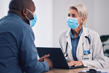 Image showing Woman, doctor and laptop with patient in consultation, checkup or help and advice at hospital. Female person, medical or healthcare expert with face mask consulting customer with technology at clinic