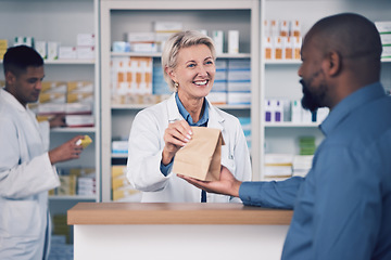 Image showing Happy woman, pharmacist and paper bag for patient, healthcare or medication at the pharmacy. Female person or medical professional giving pills, drugs or pharmaceuticals product to customer at clinic