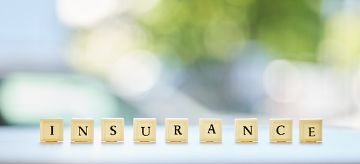 Image showing Insurance, word or message on wood blocks or letters writing about life or healthcare in an emergency or accident mockup. Planning for medical, health or banner for security and safety in the future