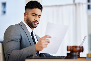 Image showing Work, reading and a lawyer with a document in an office for business, justice and a legal contract. Serious, desk and a corporate advocate with paperwork or a report on a case or review of a proposal