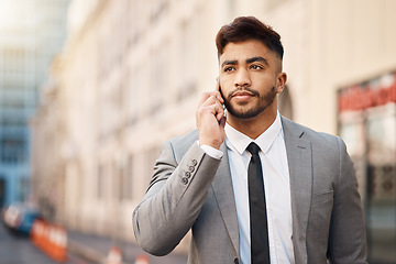 Image showing Phone call, serious and professional businessman in the city in a company consultation or conversation. Technology, networking and male lawyer talking on cellphone for communication in an urban town.