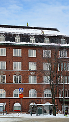 Image showing Cleaning Snow from Rooftop in City