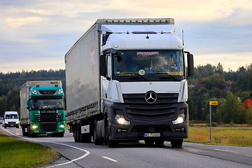 Image showing Freight Trucks on Road in the Morning