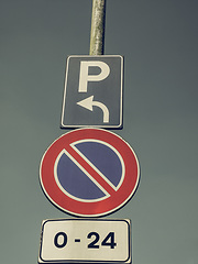 Image showing Vintage looking No parking sign over blue sky