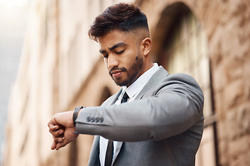 Image showing Business man check watch in city for clock, schedule and waiting for appointment, taxi and travel. Indian male worker, corporate employee and wristwatch for time management on urban commute outdoor