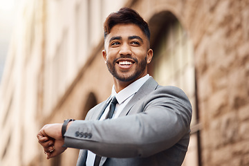 Image showing Business man, happy and watch in city for clock, schedule and waiting for appointment, opportunity or taxi on sidewalk. Indian male worker, thinking and check wristwatch for time management or travel