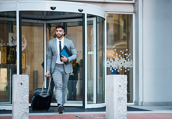 Image showing Businessman outside office, suitcase and travel for lawyer at law firm for work commute. Folder, luggage and man on sidewalk, attorney with documents at on city street at court building on urban walk