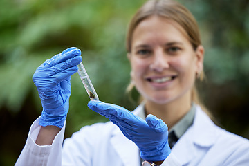 Image showing Forest, ecology and woman scientist test rock for research or inspection of the ecosystem and environment study. Science, sustainable and professional environmentalist doing carbon footprint exam