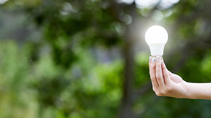 Image showing Nature, hand and lightbulb for solar energy, idea or sustainability with lighting. Creative, innovation and person with bulb for eco friendly electricity, green solution or inspiration with mockup