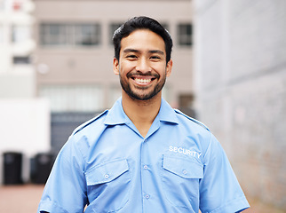 Image showing Portrait, man and happy security guard for police service, crime protection and urban safety in city street. Law enforcement, professional bodyguard and asian male officer smile in blue shirt outdoor