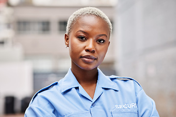 Image showing Portrait, woman and security guard in city for surveillance service, safety and patrol. Law enforcement, bodyguard or face of black female police officer in blue shirt for crime watch in urban street