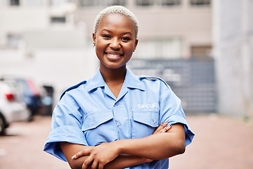 Image showing Portrait, black woman and security guard smile with arms crossed in surveillance service, safety and city patrol. Law enforcement, proud bodyguard or happy female police officer in blue shirt outdoor