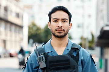 Image showing Portrait, ready or policeman in city for law enforcement, community protection or street safety. Face of cop, supervisor or serious Asian security guard on patrol in urban town for crime or justice