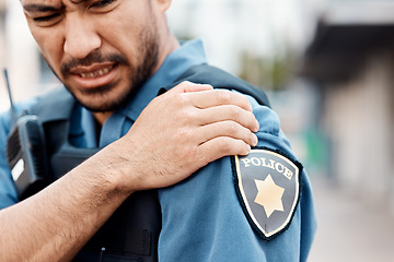 Image showing Shoulder pain, man or police officer with injury from accident crime, crisis danger or gunshot emergency in city. Law, arm or injured security guard with painful joint, inflammation or wound in town