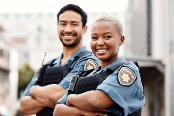 Image showing Happy police, team and arms crossed in confidence for city protection, law enforcement or crime. Portrait of man and woman officer standing ready for justice, security or teamwork in an urban town