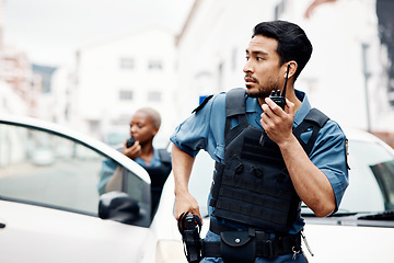 Image showing Police, emergency and officer with gun calling backup for an investigation or law protection in city or urban town. Criminal, radio and legal service team or security on duty for justice enforcement