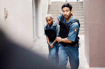 Image showing Asian man, police and gun running in city for suspect, investigation or catching criminal together. Serious male person, security guard or cop with partner for backup or crime in alley of urban town