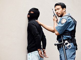 Image showing Man, police and walkie talkie with criminal for arrest, crime or justice in theft, robbery or violence. Male person, officer or security guard with handcuffs and force on suspect and calling backup