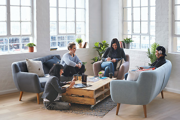 Image showing Meeting, discussion and team in the office lounge or coworking space planning a project in collaboration. Creative, diversity and business people working together with technology on sofa in workplace