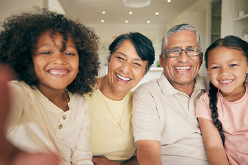 Image showing Selfie, grandparents and girls with a smile, home and quality time with social media, bonding and happiness. Portrait, elderly man or old woman with female kids, happy children and profile picture