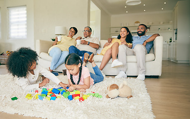 Image showing Big family, toys and children playing with parents and grandparents in lounge at home together for creative fun. Living room, happy and development of kids on carpet floor with games by mom and dad