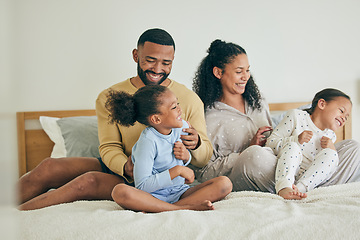 Image showing Morning, family and playful with children on bed for happiness on weekend for quality time in home. Fun, father and mother with kid together in bedroom with love or laugh and care with bonding.