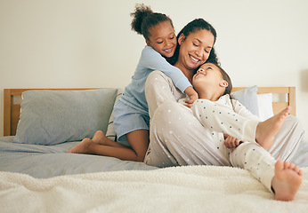 Image showing Mother, bed and children hug or happy with parent together in the morning laughing in a bedroom in a home. Funny, bonding and mom enjoy quality time with kids or girls with happiness and love