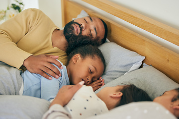 Image showing Sleeping, comfort and family in bed relax, resting and dreaming in their home together. Peaceful, sleep and parents embrace children in bedroom for nap, relaxation or cozy, love and sweet on weekend