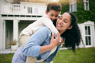 Image showing Mother, son and piggyback, hug outdoor with love and bonding, relax on lawn at holiday home with fun and happiness. Playful, smile and trust, woman and boy together in garden with vacation and nature