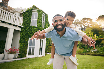Image showing Father, child and piggyback outdoor or garden for real estate happiness, celebration and game at new house. Dream home, freedom and excited child with dad on lawn running and flying on property