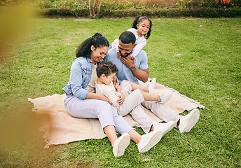 Image showing Playful, park and family with love, happy and quality time to relax, bonding and loving together. Parents, mother on the grass and father with children, kids and fun outdoor, cheerful and happiness