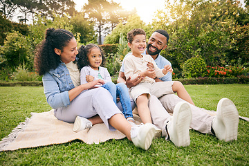 Image showing Picnic, nature or happy family relax, laugh or enjoy outdoor quality time together, funny joke and comedy. Summer freedom, green grass field or bonding mother, father and kids laughing in garden park