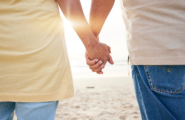 Image showing Senior, love and couple holding hands at the beach in support or help of health crisis, cancer or mental health problem. Old people, empathy and solidarity in depression, anxiety or trust or comfort