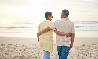 Image showing Beach, hug and rear view of senior couple with love, bond and happy while walking in nature together. Back, embrace and old people enjoy retirement with ocean travel, vacation and holiday at the sea