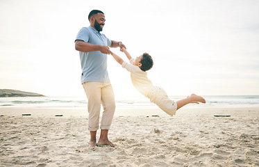 Image showing Freedom, father and boy child at a beach with swing, fun and game while bonding in nature together. Love, ocean and parent playing with kid at the sea for travel holiday and vacation in Cancun