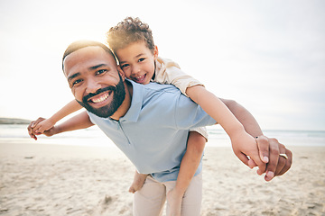 Image showing Father, son and piggyback, beach and portrait with love and bonding, travel and ocean with holiday, fun and happiness. Playful, smile and trust, man and boy together with vacation and sea adventure