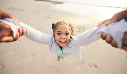 Image showing Happy, swinging and portrait of child at the beach for travel, support and fun. Spinning, smile and summer with girl and holding hands with family together for vacation, trust and seaside holiday